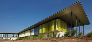 The roof of the library, at the western end, extends beyond the building in a gesture that is visible throughout the surrounding suburb: a deliberate attempt to make the school a beacon in the landscape